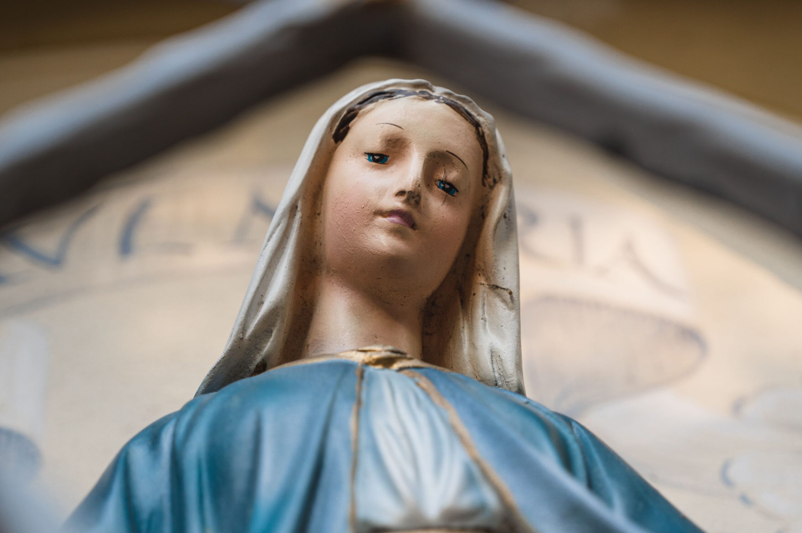 Detailed close-up of a Virgin Mary statue showcasing spiritual symbolism.